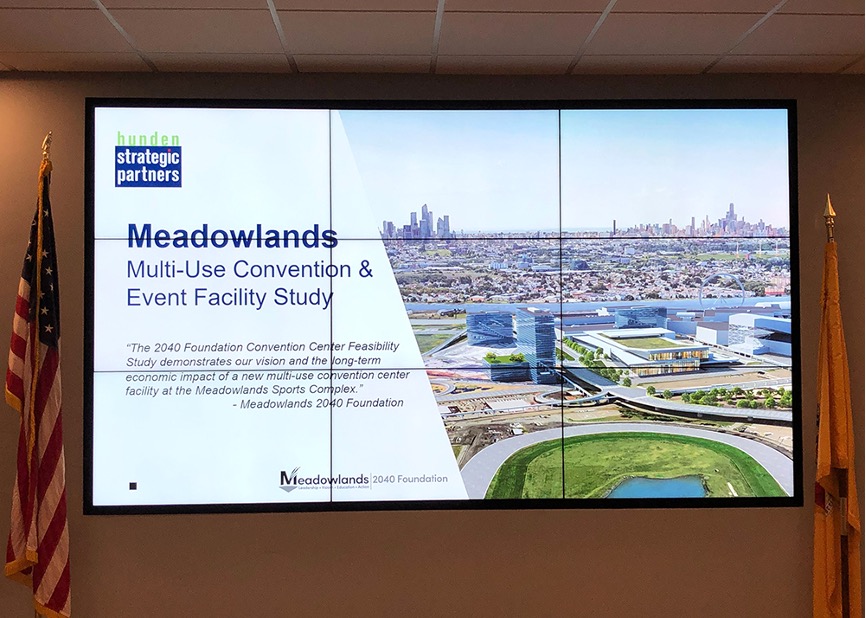 Presentation slide with photo of the New Jersey Meadowlands development